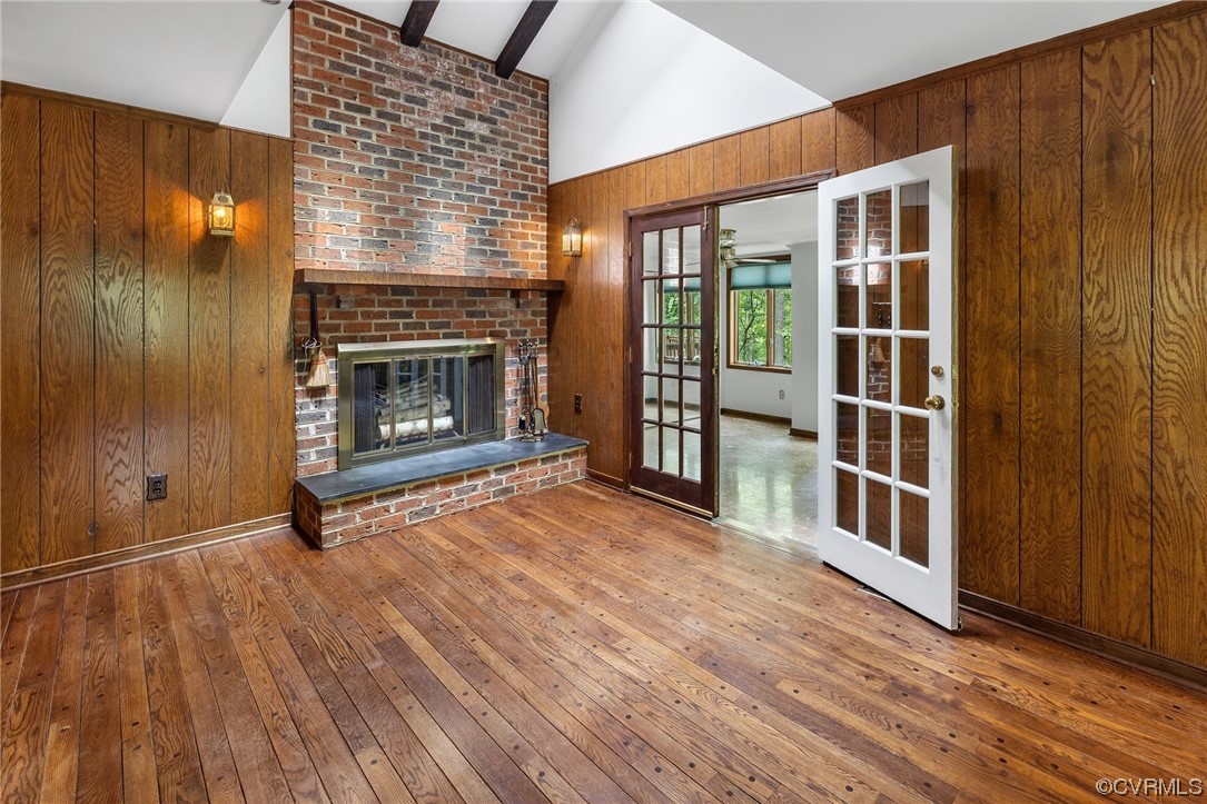1600 Beaverdam Creek Road Crozier, VA 23039 - Photo 15 of 45 a view of an empty room with wooden floor fireplace and a window