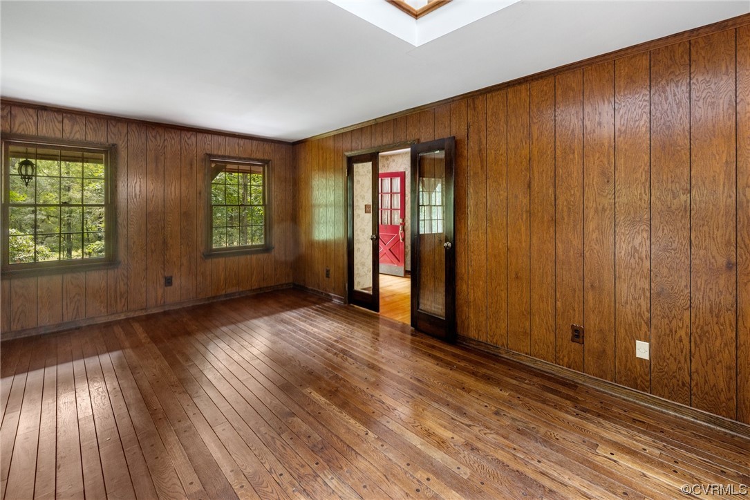 1600 Beaverdam Creek Road Crozier, VA 23039 - Photo 17 of 45 an empty room with wooden floor and windows
