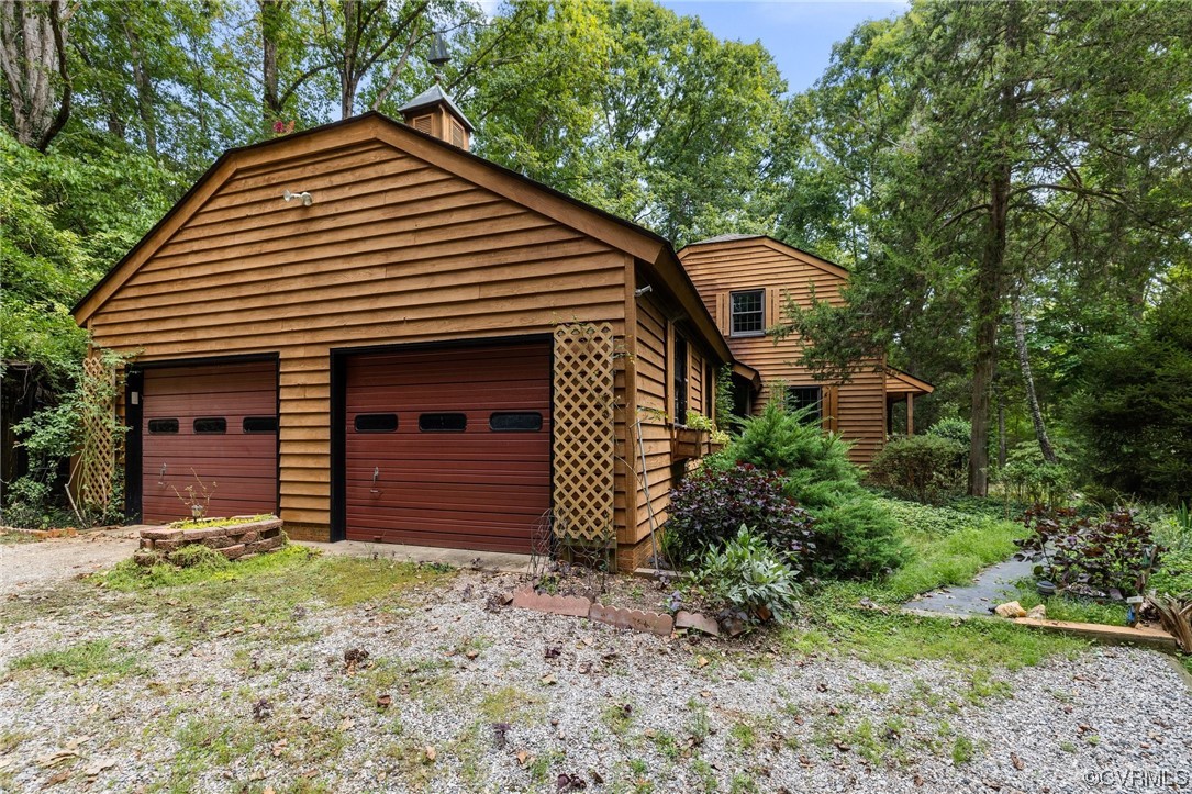 1600 Beaverdam Creek Road Crozier, VA 23039 - Photo 3 of 45 a front view of a house with a garden