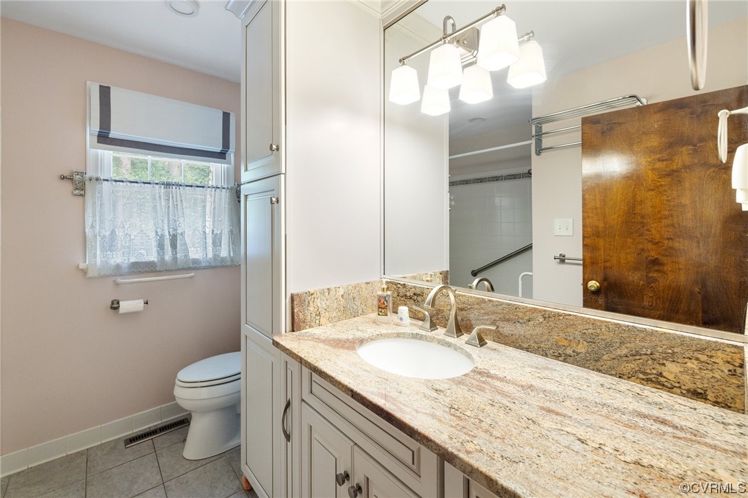 1600 Beaverdam Creek Road Crozier, VA 23039 - Photo 33 of 45 a bathroom with a granite countertop sink a toilet and a mirror