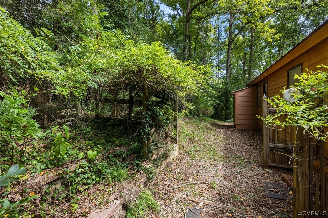 1600 Beaverdam Creek Road Crozier, VA 23039 - Photo 36 of 45 a backyard of a house with lots of green space