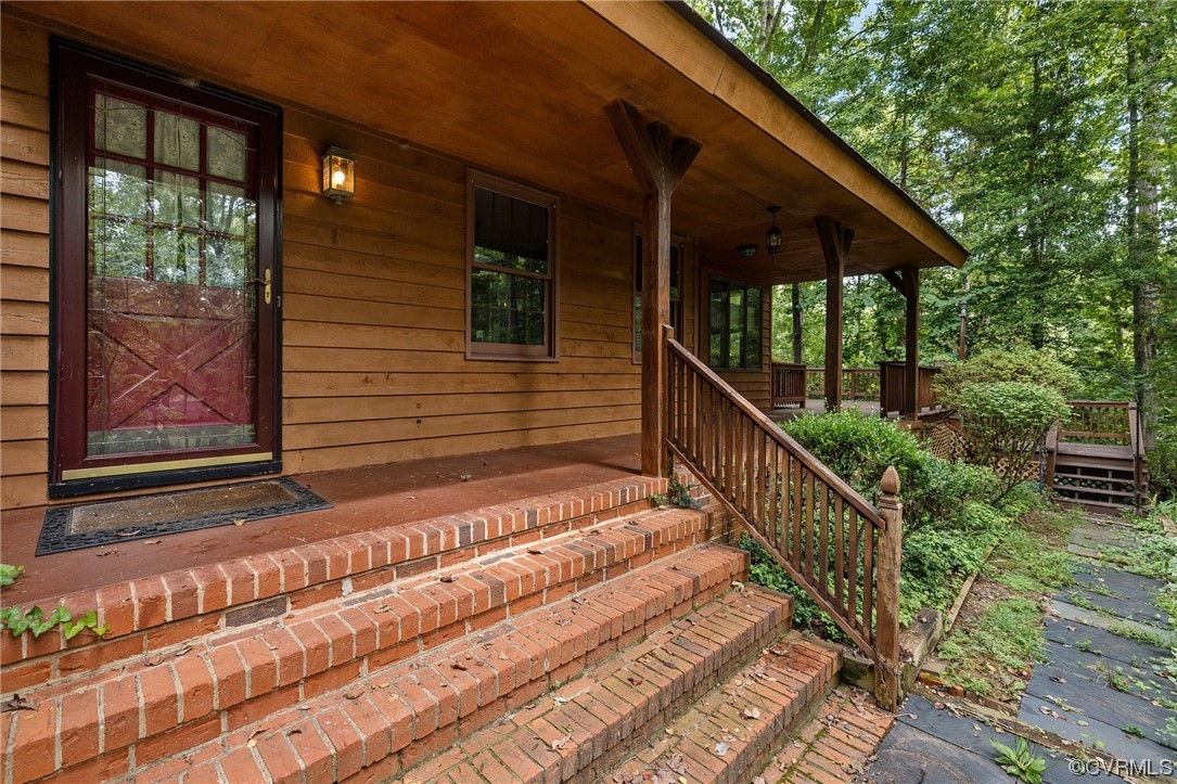 1600 Beaverdam Creek Road Crozier, VA 23039 - Photo 4 of 45 a view of backyard with deck and wooden floor