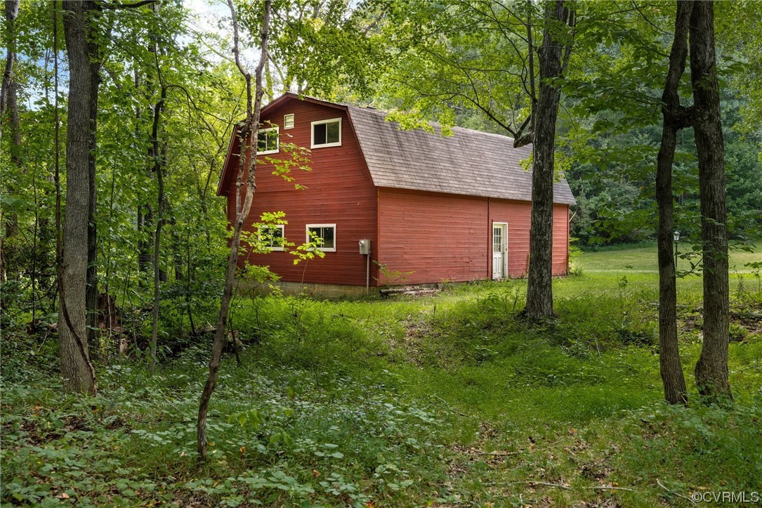1600 Beaverdam Creek Road Crozier, VA 23039 - Photo 6 of 45 a front view of a house with garden