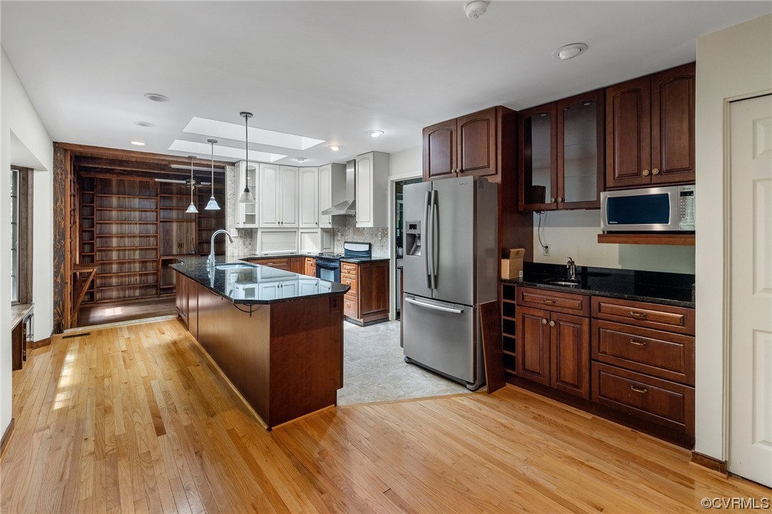 1600 Beaverdam Creek Road Crozier, VA 23039 - Photo 7 of 45 a kitchen with stainless steel appliances a refrigerator and wooden cabinets