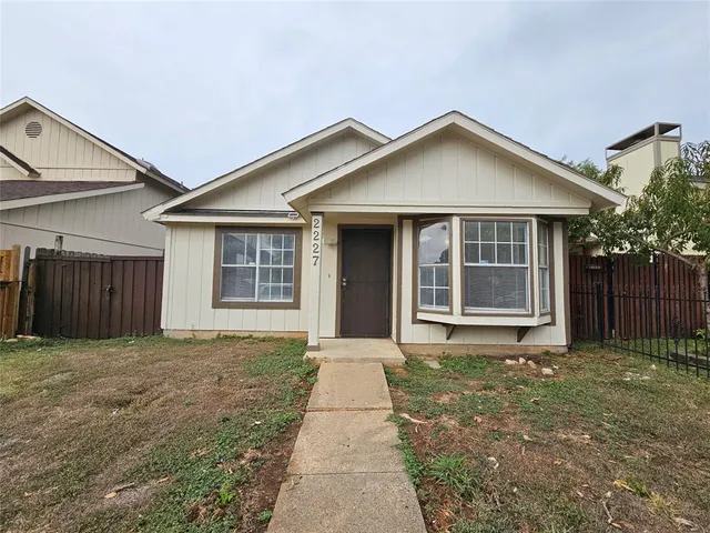a front view of a house with yard