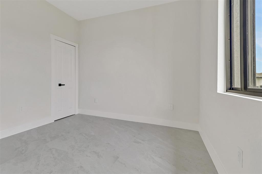 4501 15th Street Southwest Lehigh Acres, FL 33973 - Photo 18 of 40 a view of an empty room