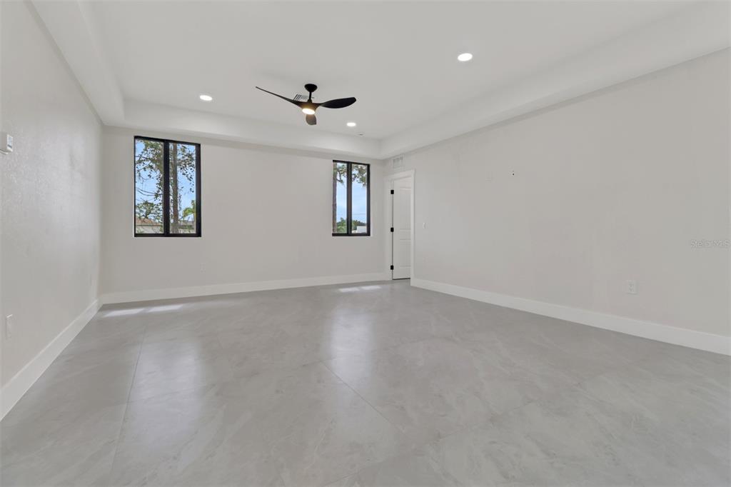 4501 15th Street Southwest Lehigh Acres, FL 33973 - Photo 26 of 40 an empty room with a empty space and windows