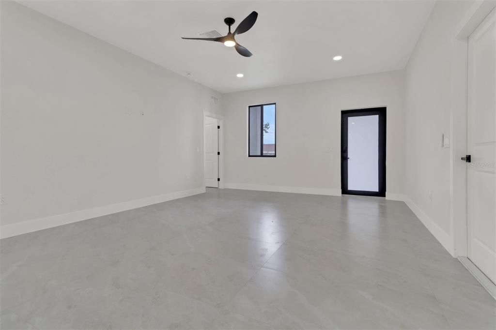 4501 15th Street Southwest Lehigh Acres, FL 33973 - Photo 3 of 40 an empty room with a empty space and windows