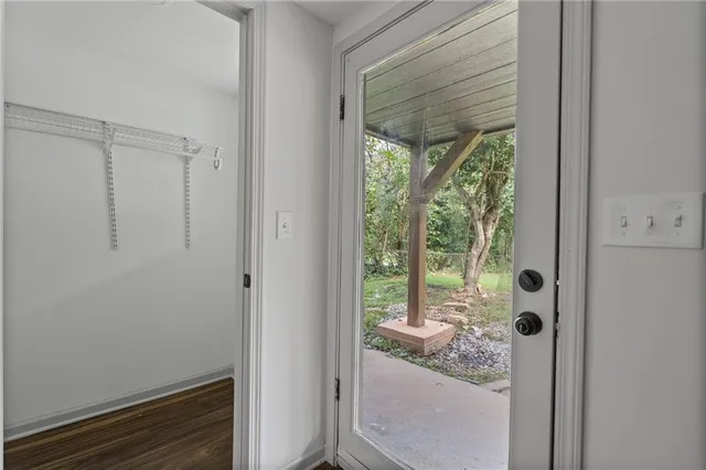 a bathroom with a glass door shower and a sink