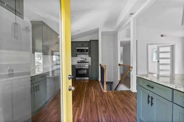 a view of a kitchen from the hallway