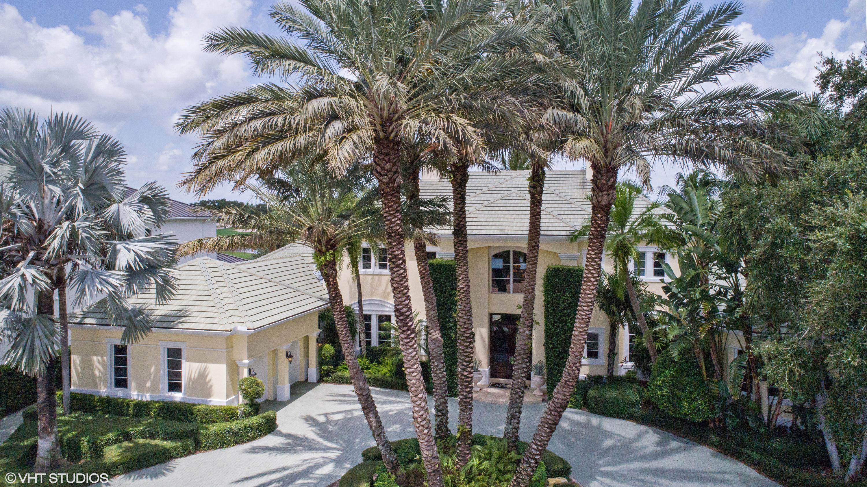 119 Terrapin Trail Jupiter, FL 33458 - Photo 2 of 41 a front view of a house with garden