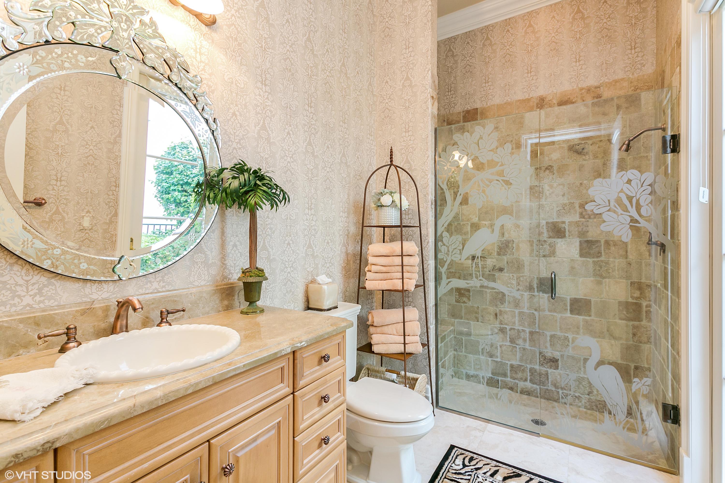 119 Terrapin Trail Jupiter, FL 33458 - Photo 22 of 41 a bathroom with a granite countertop sink a toilet and a mirror