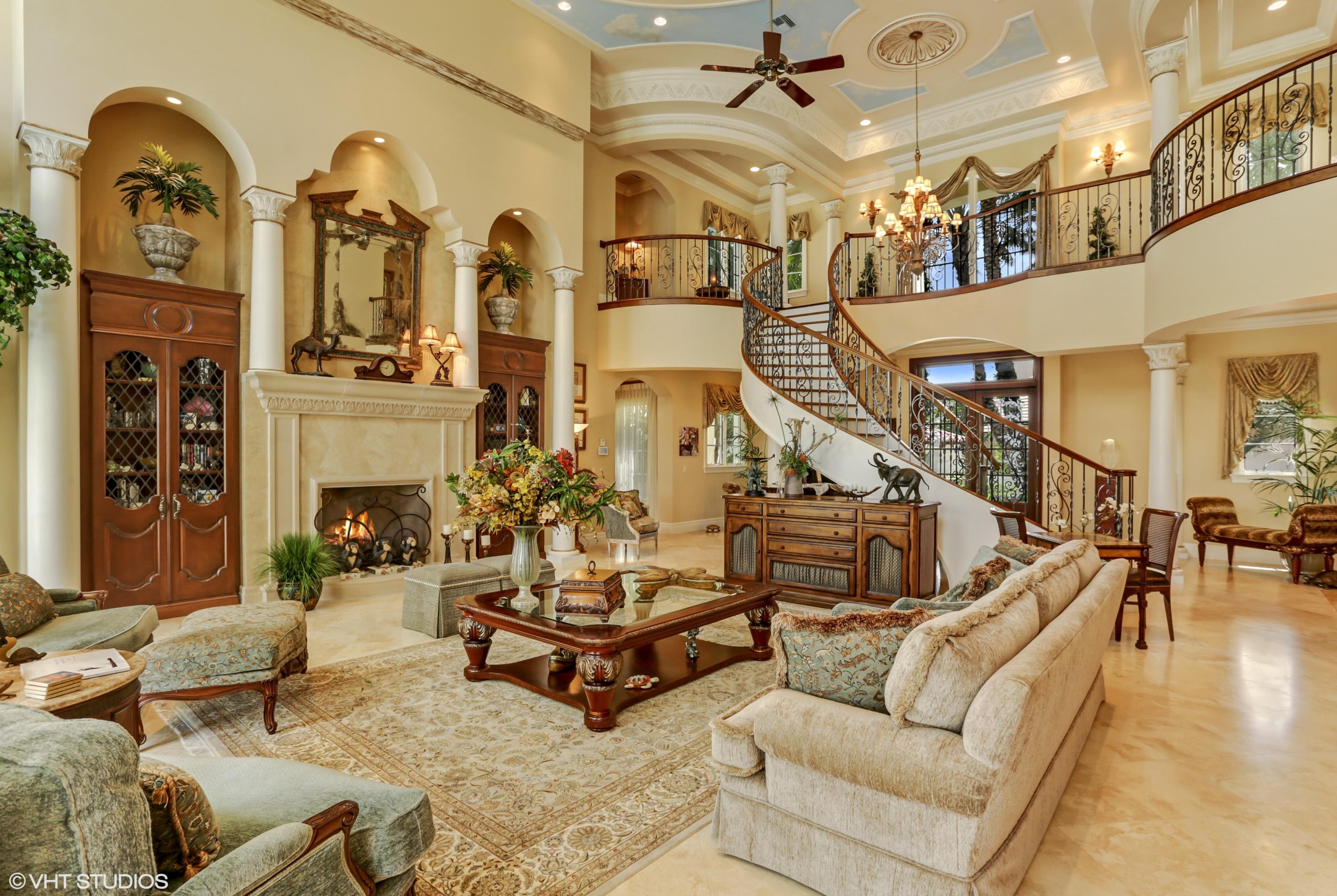 119 Terrapin Trail Jupiter, FL 33458 - Photo 39 of 41 a living room with fireplace furniture and a chandelier