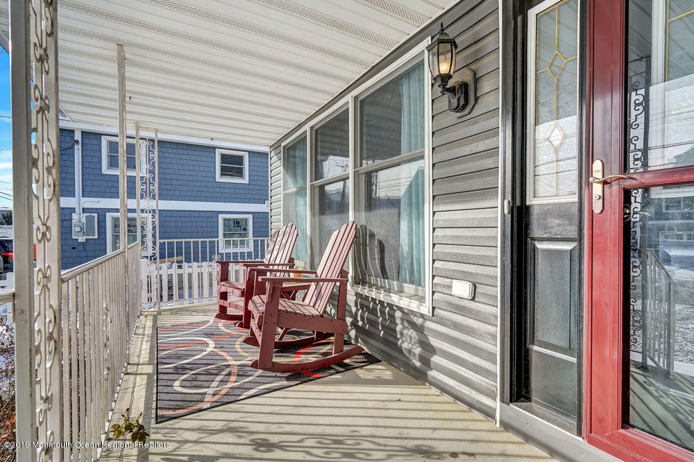 719 Drum Point Road Brick, NJ 08723 - Photo 3 of 37 a view of a chairs on the deck