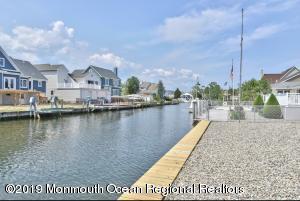 719 Drum Point Road Brick, NJ 08723 - Photo 37 of 37 a view of a lake with a house