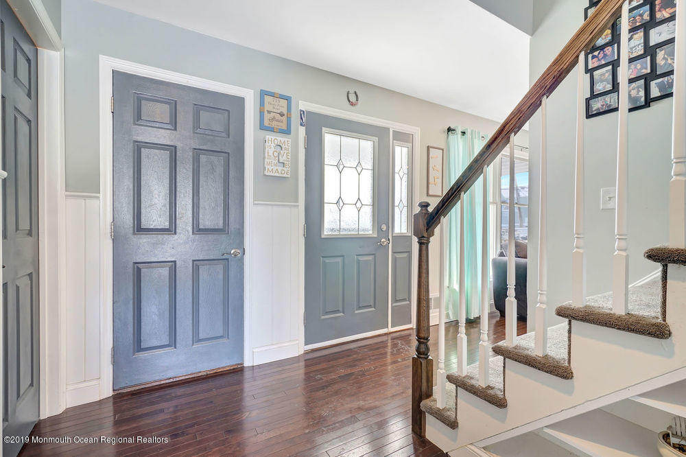 719 Drum Point Road Brick, NJ 08723 - Photo 4 of 37 a view of an entryway with wooden floor and door