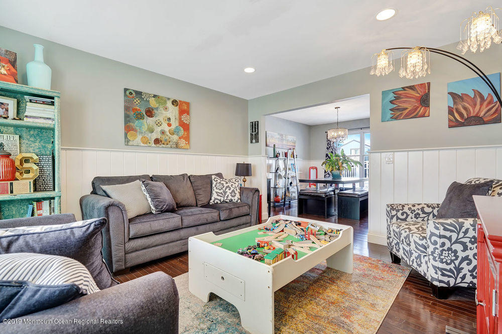 719 Drum Point Road Brick, NJ 08723 - Photo 5 of 37 a living room with furniture and a table