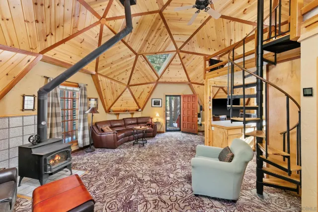 a living room with furniture a flat screen tv and couches