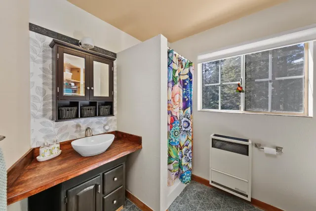 a bathroom with a sink and a mirror