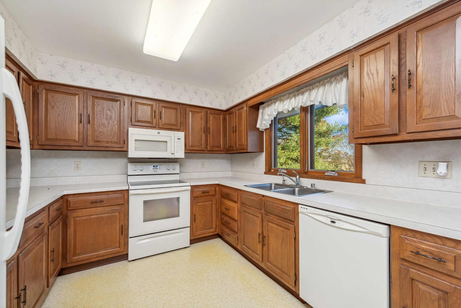 17445 Livingston School Road Caledonia, IL 61011 - Photo 13 of 33 a kitchen with granite countertop cabinets stainless steel appliances a sink and window