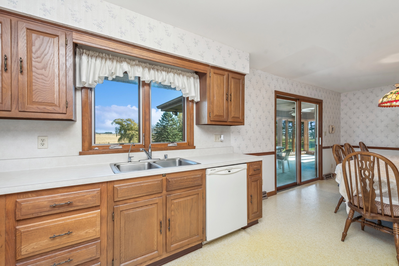 17445 Livingston School Road Caledonia, IL 61011 - Photo 14 of 33 a kitchen with sink cabinets and window