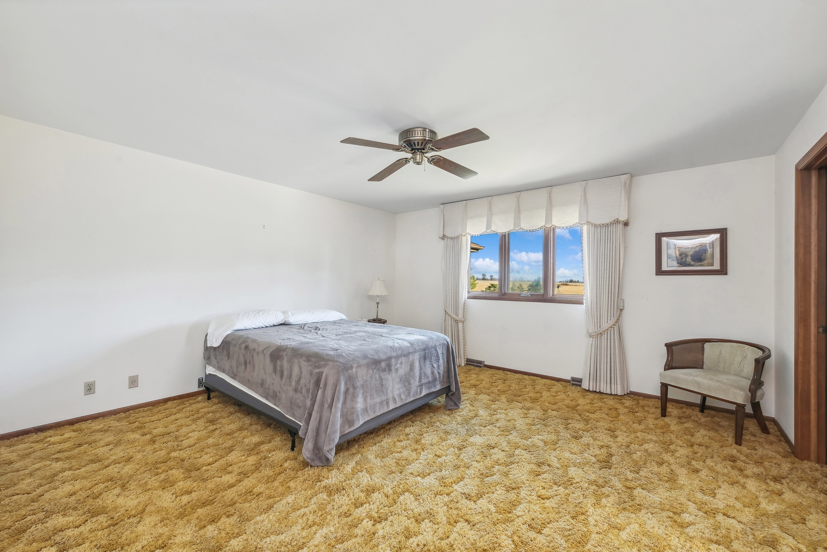 17445 Livingston School Road Caledonia, IL 61011 - Photo 17 of 33 a bedroom with a bed and window