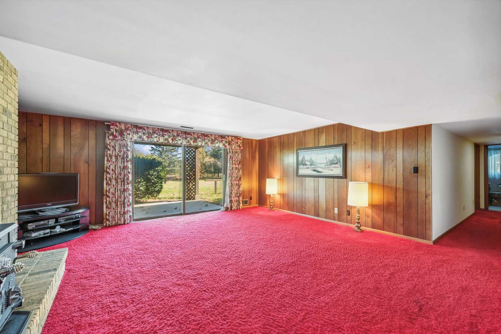 17445 Livingston School Road Caledonia, IL 61011 - Photo 21 of 33 a large bedroom with a bed and a flat screen tv
