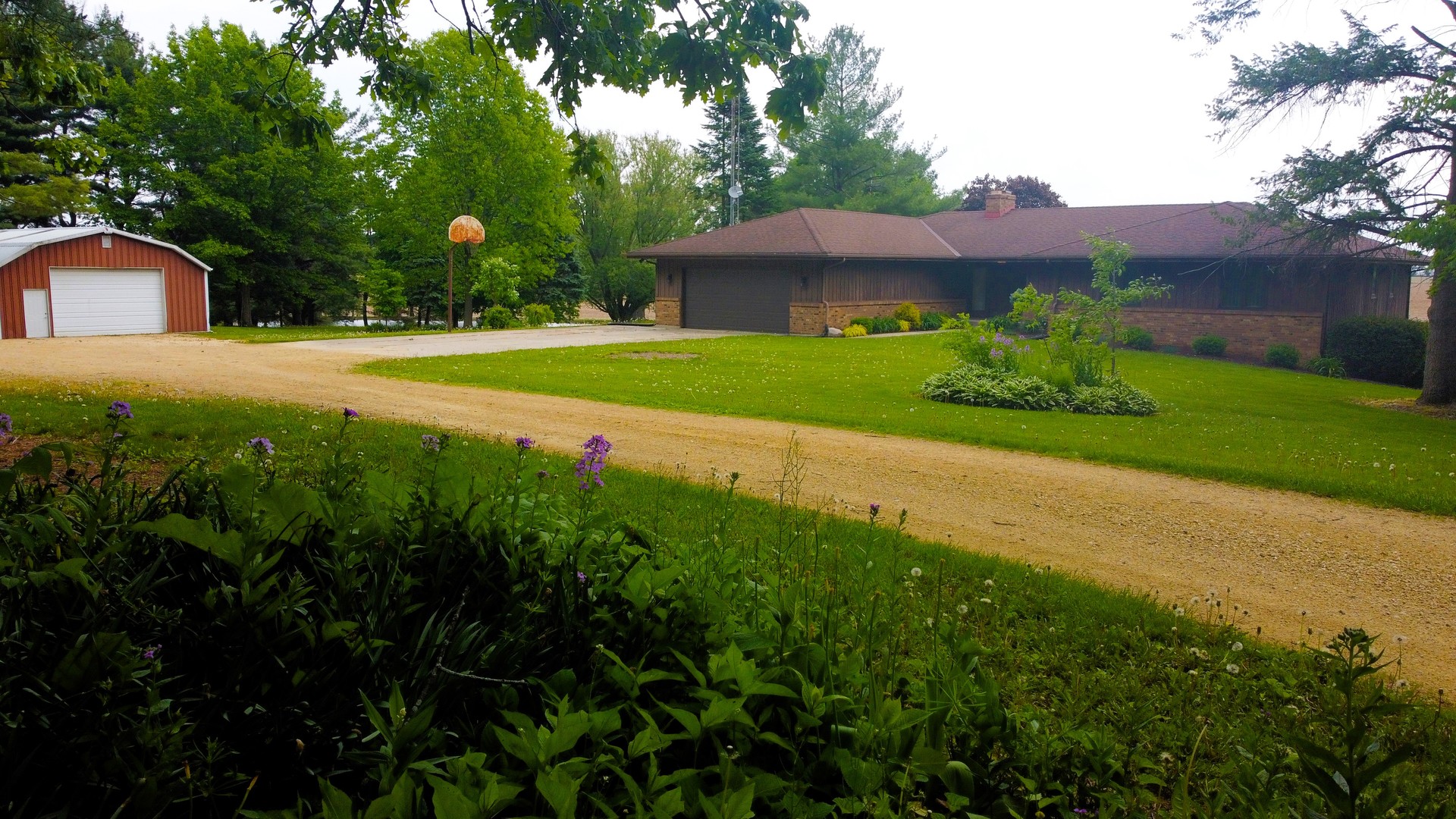 17445 Livingston School Road Caledonia, IL 61011 - Photo 4 of 33 a view of a house with a garden
