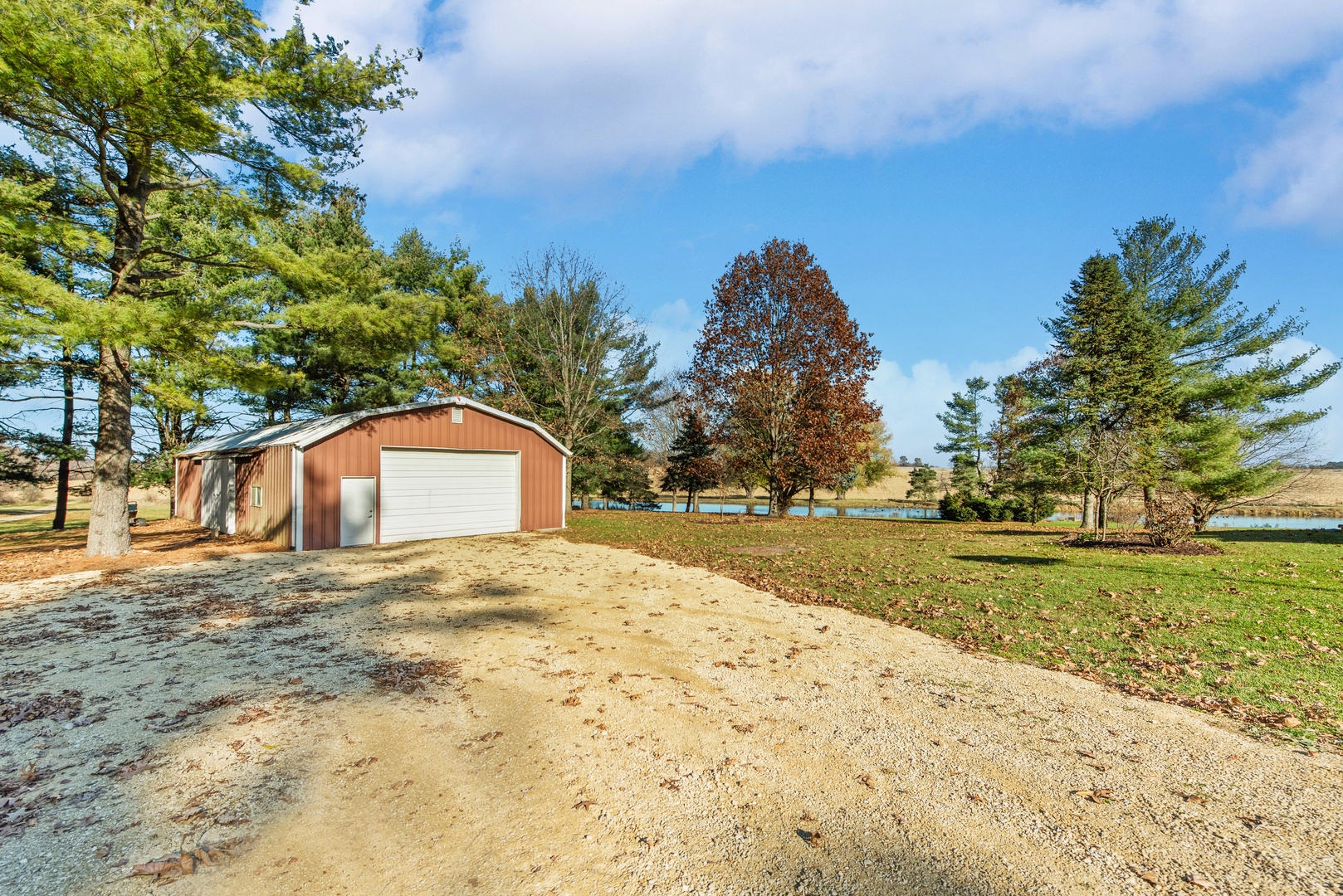 17445 Livingston School Road Caledonia, IL 61011 - Photo 9 of 33 a large tree in front of a white house