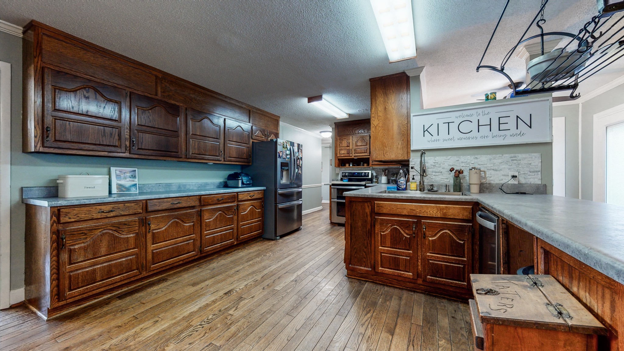 208 Old Quick Road Fayetteville, TN 37334 - Photo 7 of 51 a kitchen with stainless steel appliances granite countertop wooden cabinets a sink and dishwasher