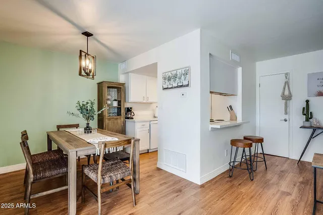 a kitchen with a sink a stove and a microwave