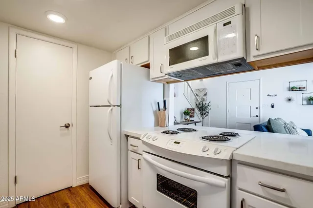 a kitchen with a stove and a microwave
