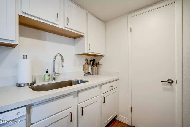 a kitchen with a stove and a microwave