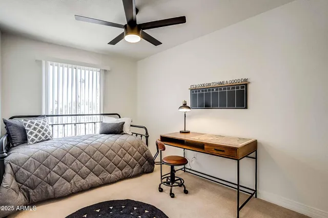 a bedroom with furniture and a window