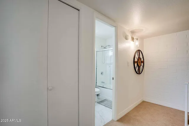 a bathroom with a toilet and a sink