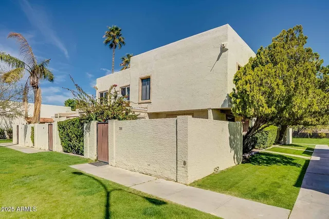 a view of a swimming pool with a patio and a garden