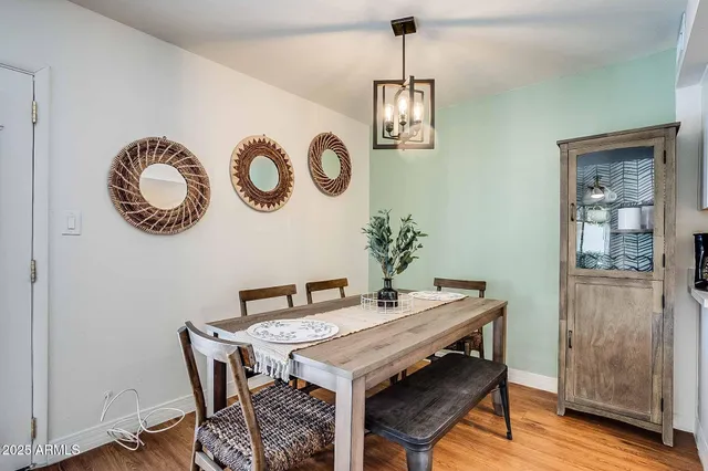 a view of a dining area with furniture and wooden floor