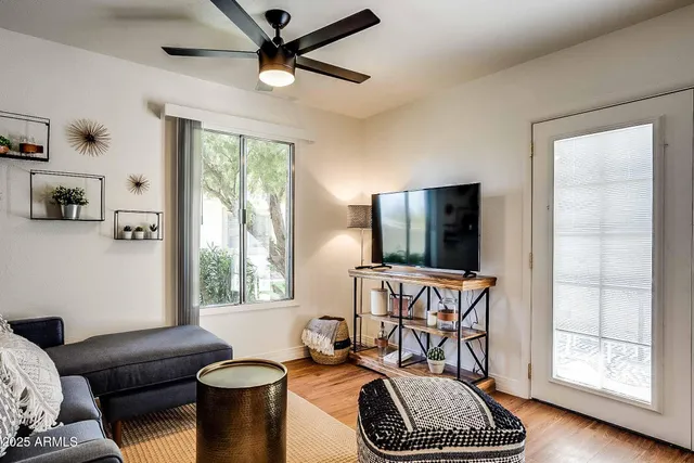 a living room with furniture and a window