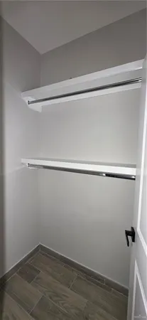 a bathroom with a double vanity sink toilet and shower