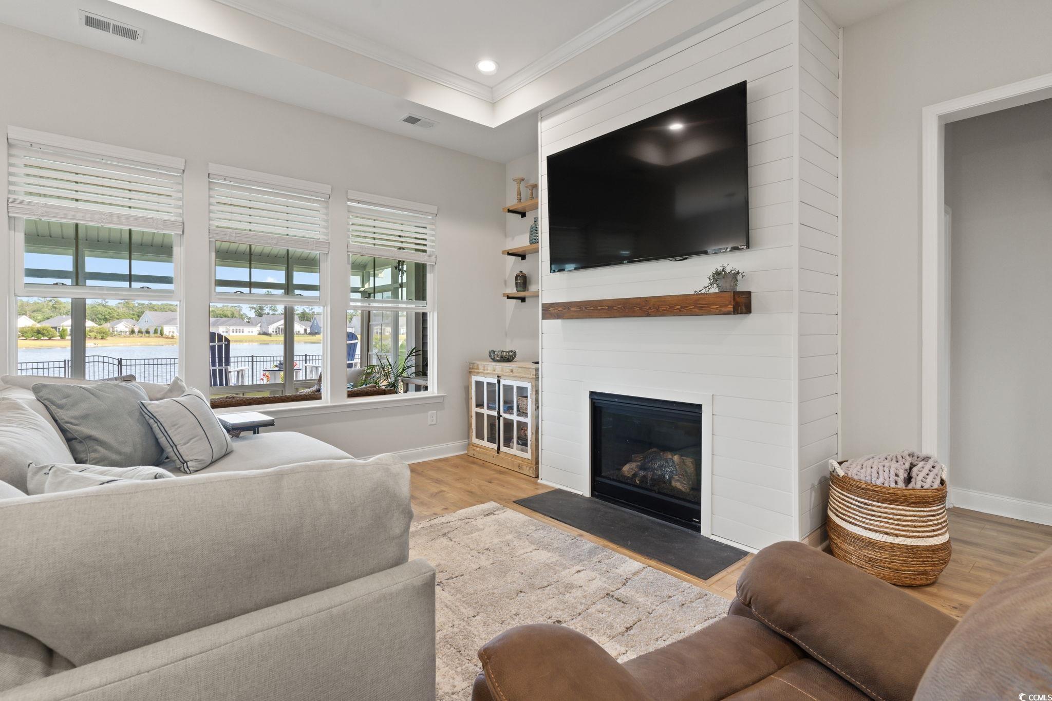 389 Bumble Circle Murrells Inlet, SC 29576 - Photo 10 of 40 Living room with a fireplace, a wealth of natural