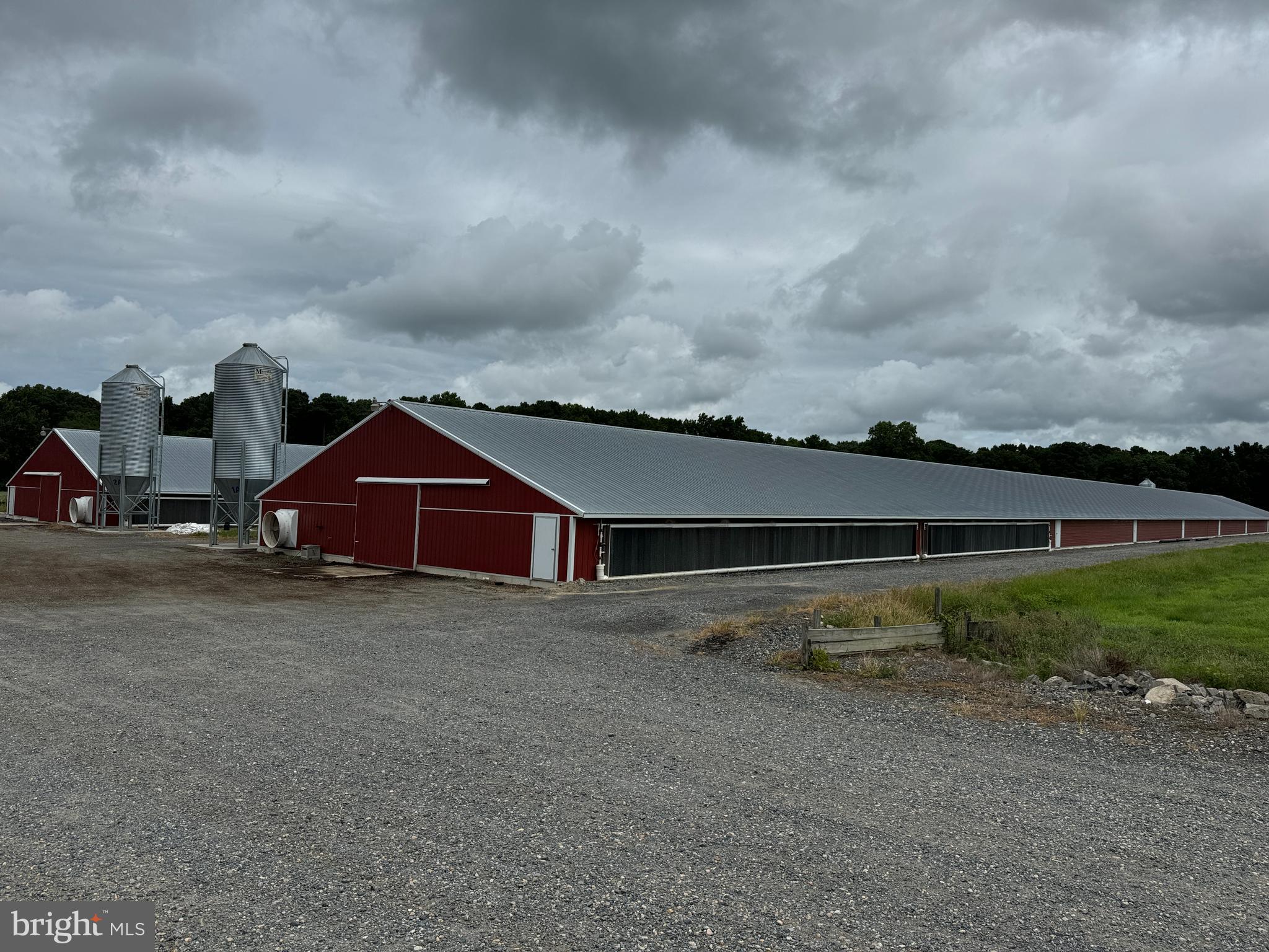 4689 Woodpecker Road Seaford, DE 19973 - Photo 2 of 10 a view of a big house with a big yard and large trees