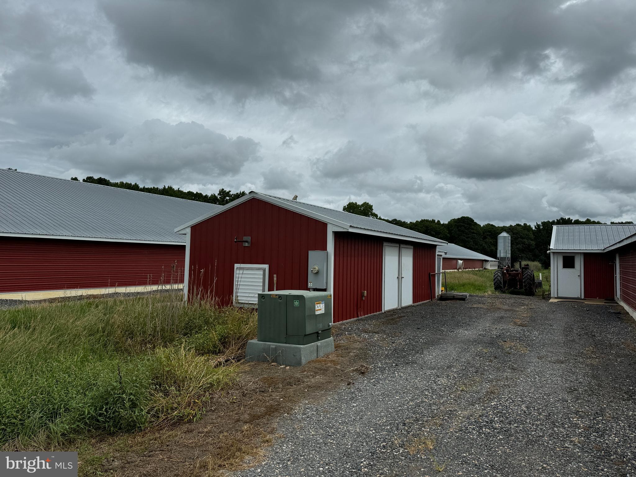 4689 Woodpecker Road Seaford, DE 19973 - Photo 3 of 10 a view of a house with a yard and wooden fence