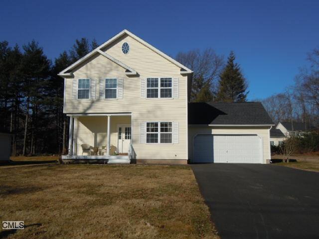a front view of a house with a garage