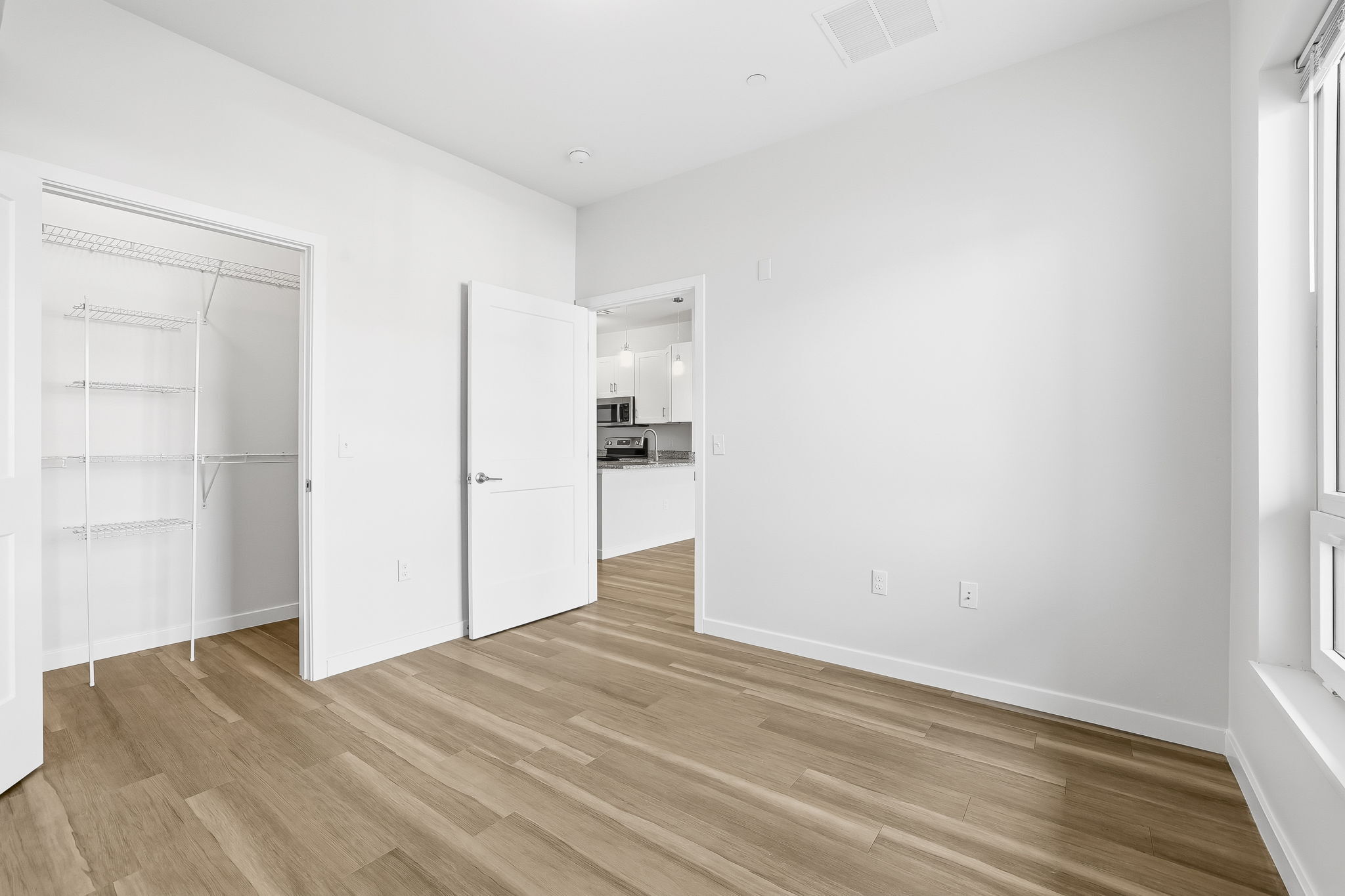 71 Connecticut Avenue, Unit 205 Norwalk, CT 06850 - Photo 15 of 17 a view of a kitchen with wooden floor and a sink