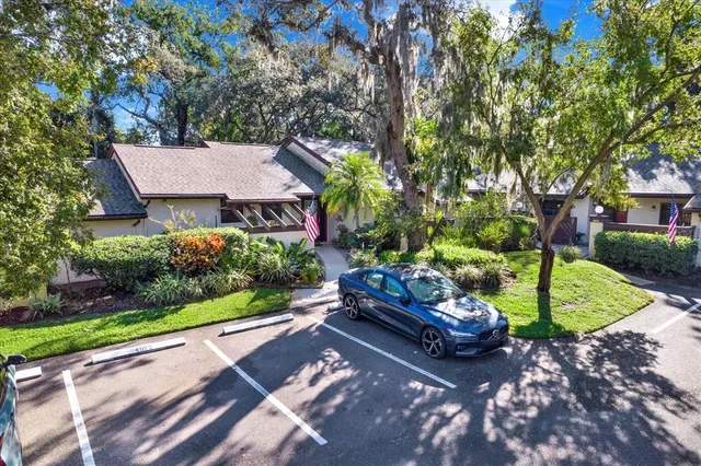 a view of a house with backyard and garden