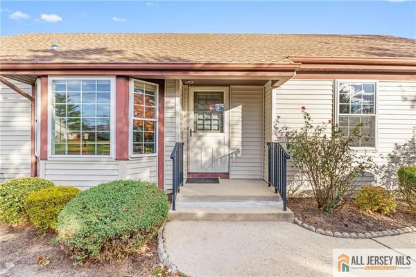 a front view of a house with a porch
