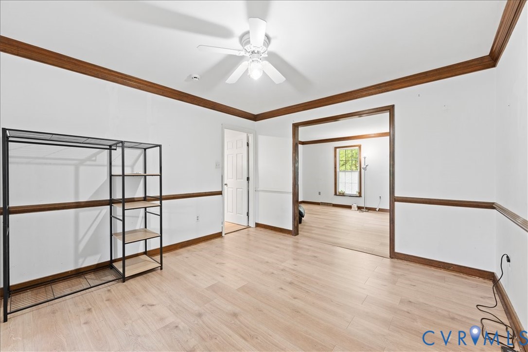 7141 Barkbridge Road Chesterfield, VA 23832 - Photo 12 of 44 Empty room featuring crown molding, light wood fin