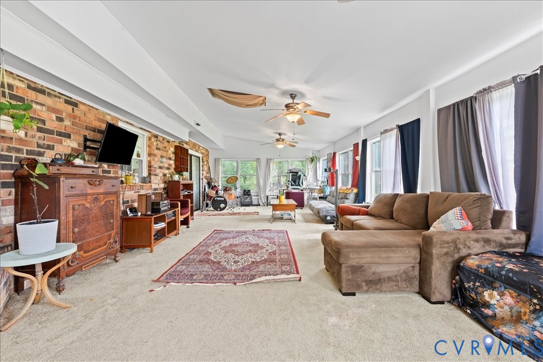 7141 Barkbridge Road Chesterfield, VA 23832 - Photo 22 of 44 Florida Room room with a ceiling fan and brick wal
