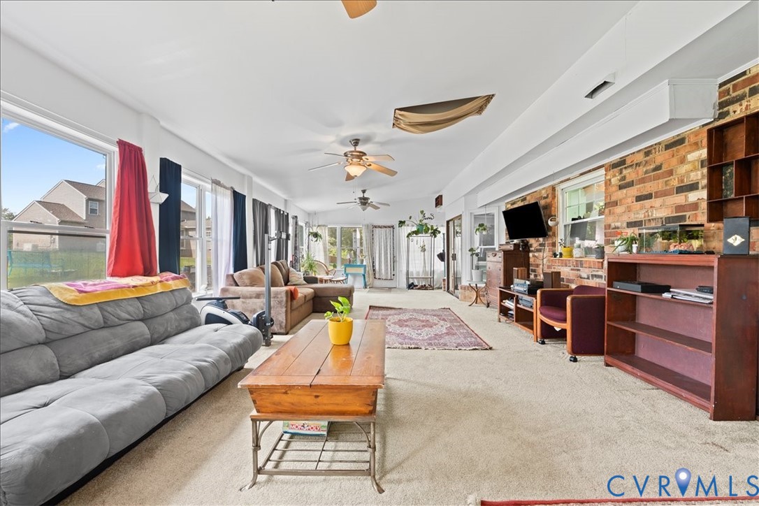 7141 Barkbridge Road Chesterfield, VA 23832 - Photo 23 of 44 Sunroom with carpet and brick wall