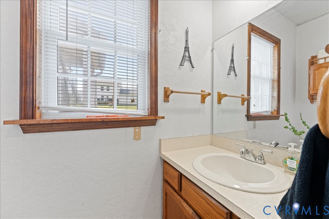 7141 Barkbridge Road Chesterfield, VA 23832 - Photo 27 of 44 Bathroom with a textured wall and vanity